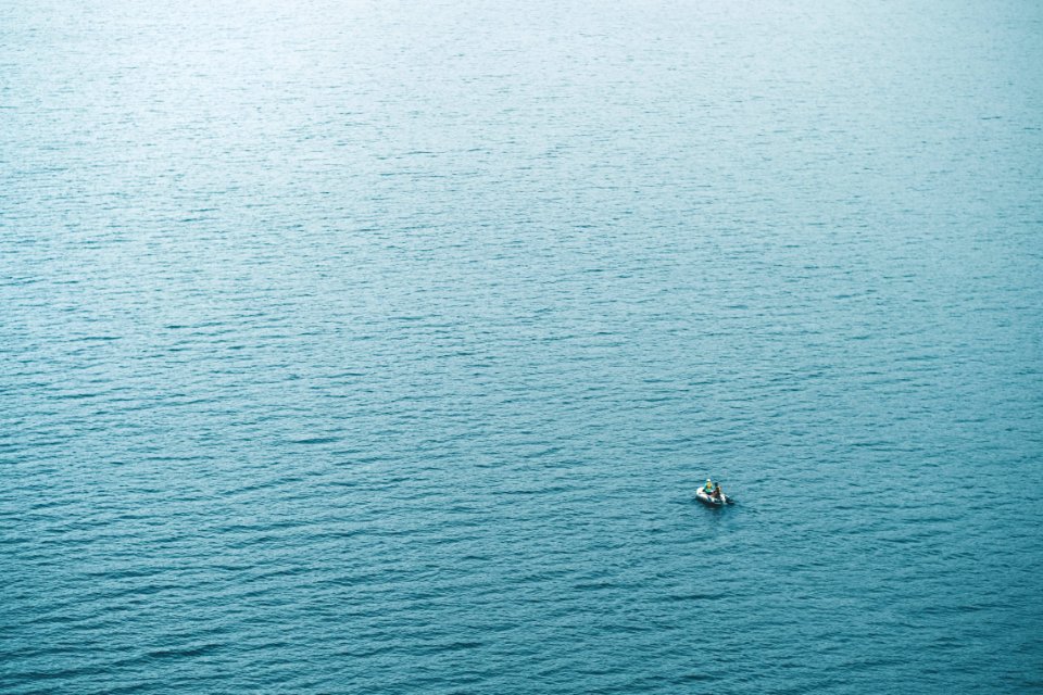 person in boat sailing at daytime