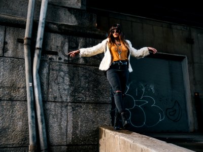 woman standing near water pipes