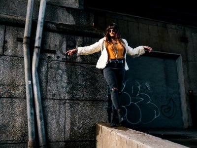 woman standing near water pipes photo