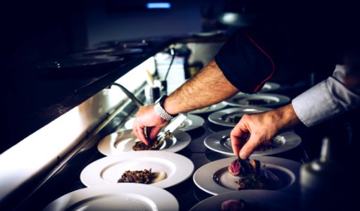 person preparing cooked dish photo