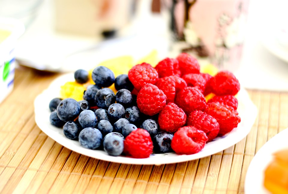 strawberries and blue berries on palte
