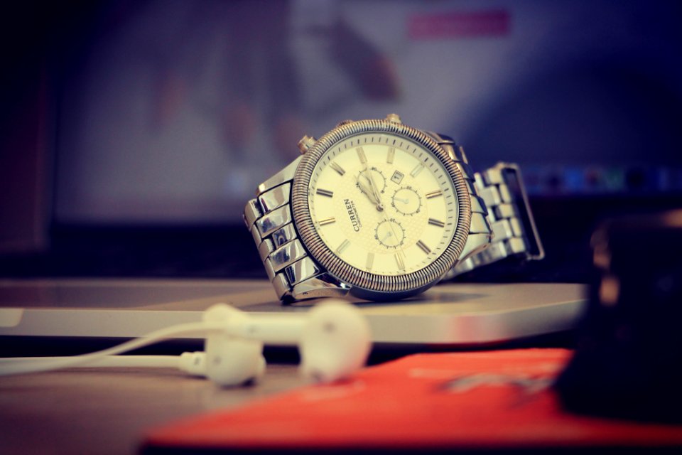 round silver-colored analog watch with link bracelet
