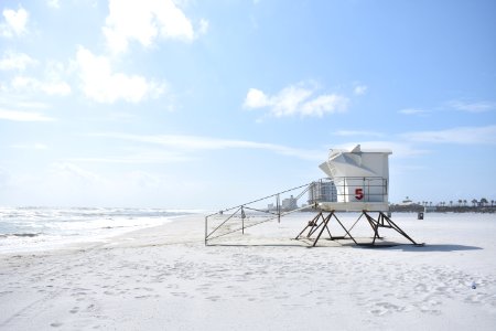 white life guard house on seashore photo