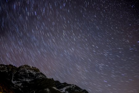 photograph of mountain under milky way photo