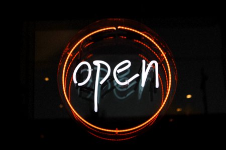 white and orange open LED signage turned on
