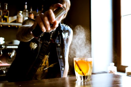bartender holding spray bottle
