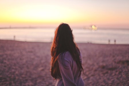 woman wearing sweater on shore