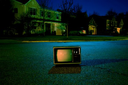turned off vintage CRT television on road