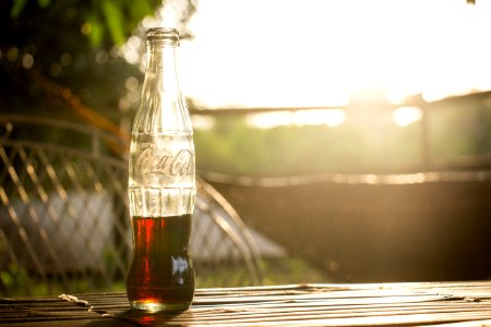 selective photo of a Coca-Cola bottle