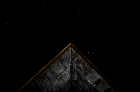 gray roof under starry sky at nighttime photo