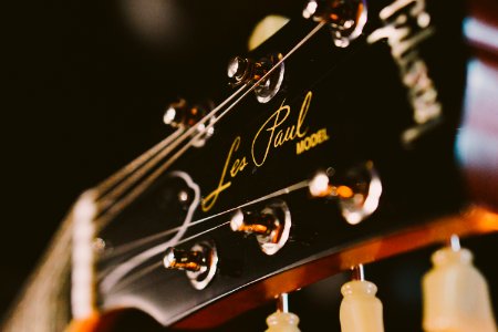 black and brown Gibson Les Paul guitar head stock photo
