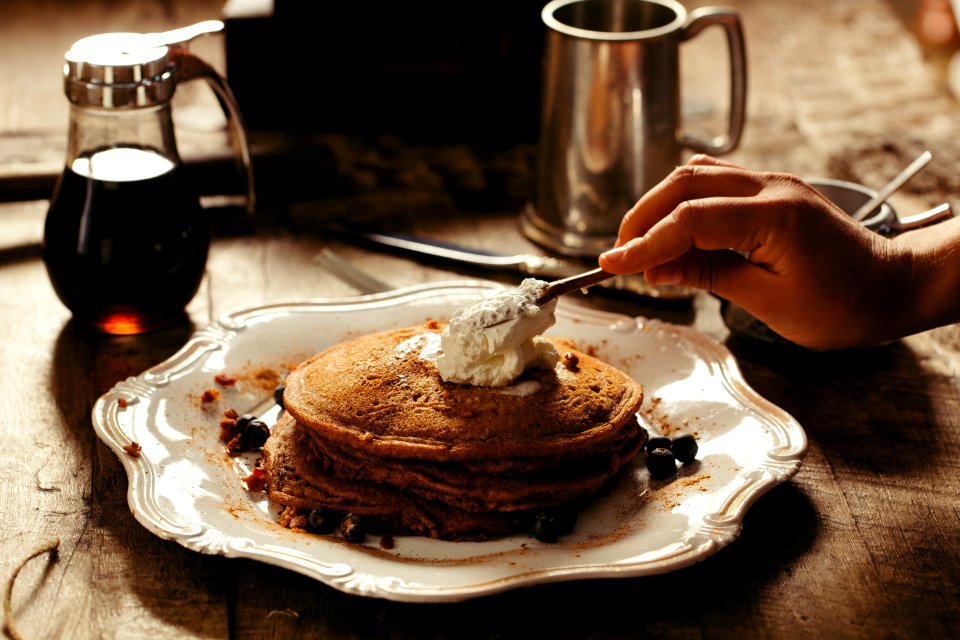 pancake with butter on white ceramic plate