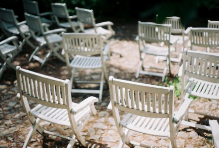empty white wooden folding chairs photo