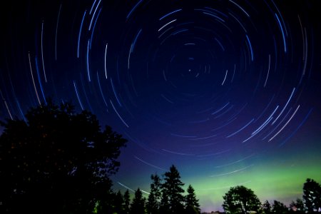 Circular shapes formed by star moving across the night sky photo
