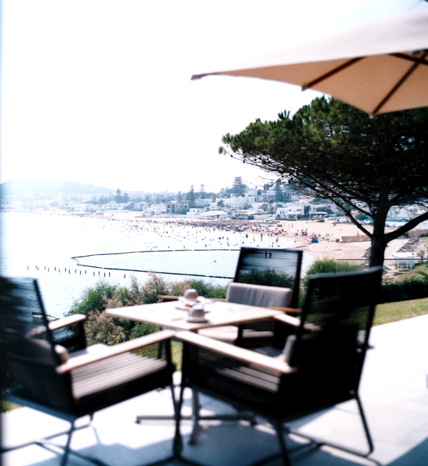 square brown table and four chairs patio set