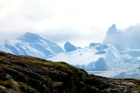 glacier near gray rock formation photo