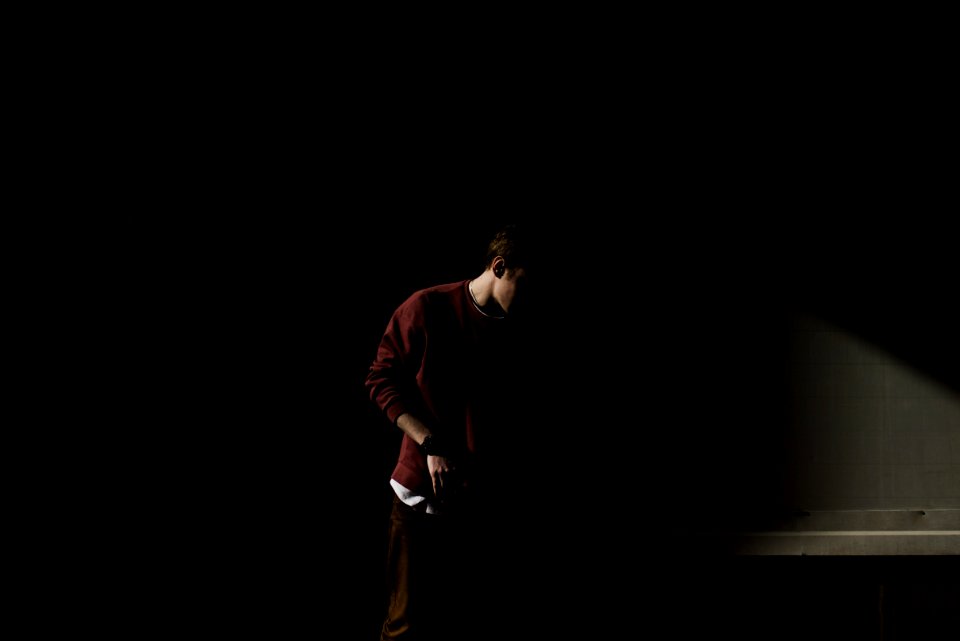 man looking at the floor