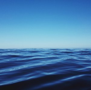 body of water under clear blue sky photo