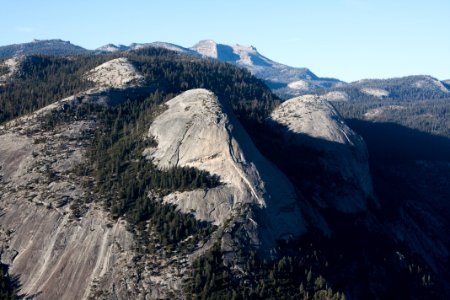 aerial photography of folding mountain with trees at daytime photo