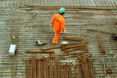 man walking on construction site photo