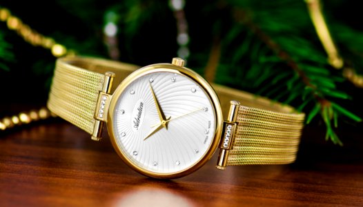 shallow focus photography of round gold-colored analog watch photo