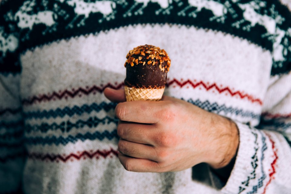 person holding ice cream cone photo