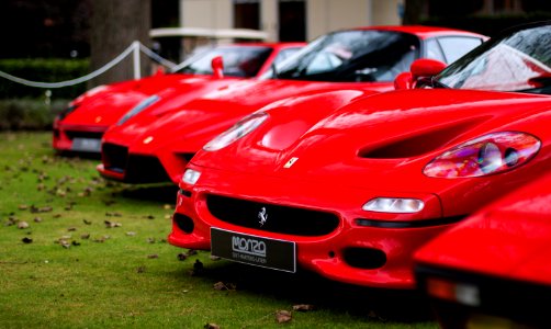 three red Ferrari cards