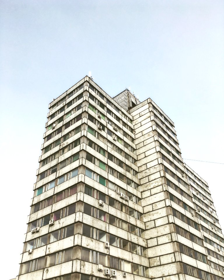 low-angle photography of grey high-rise building