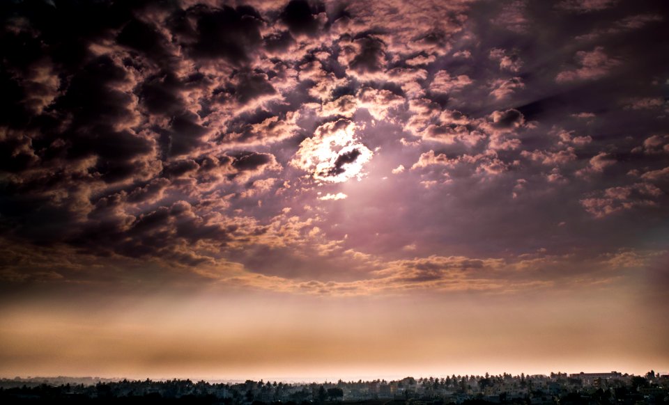 sun covered by cloudy sky