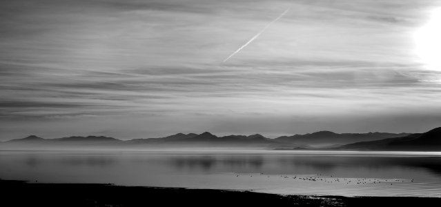grayscale photography of ocean and island