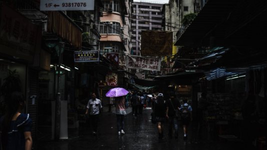 photography of people walk during rain photo