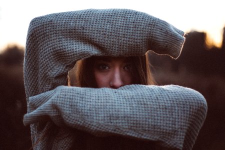 woman hiding her face