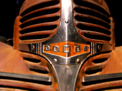 Rusty chrome grille of old dodge car.
