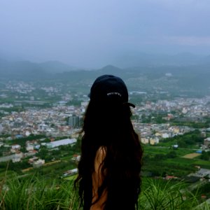 woman standing on mountain photo
