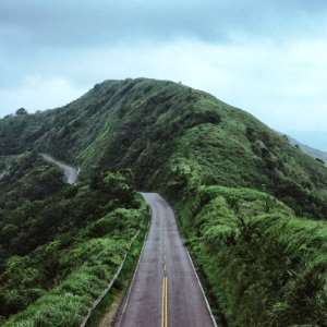 photo of road between mountain photo