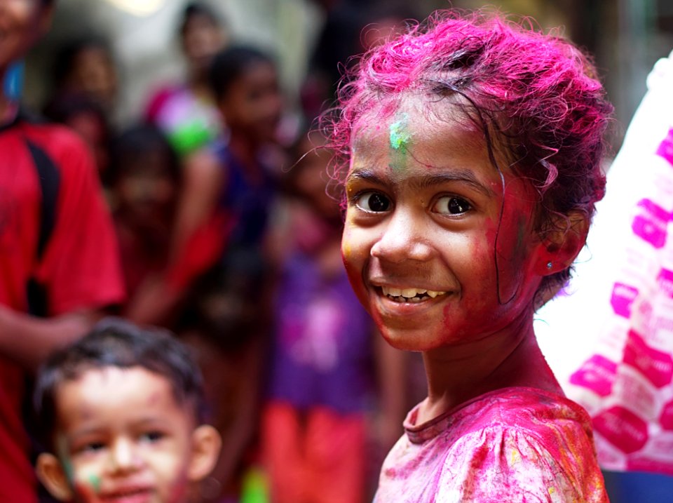 selective focus photo of girl in shirt smiling