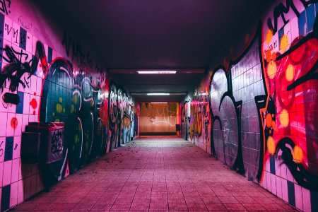 empty tunnel pathway with graffiti walls photo