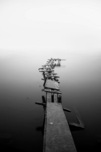 grayscale photo of dock photo