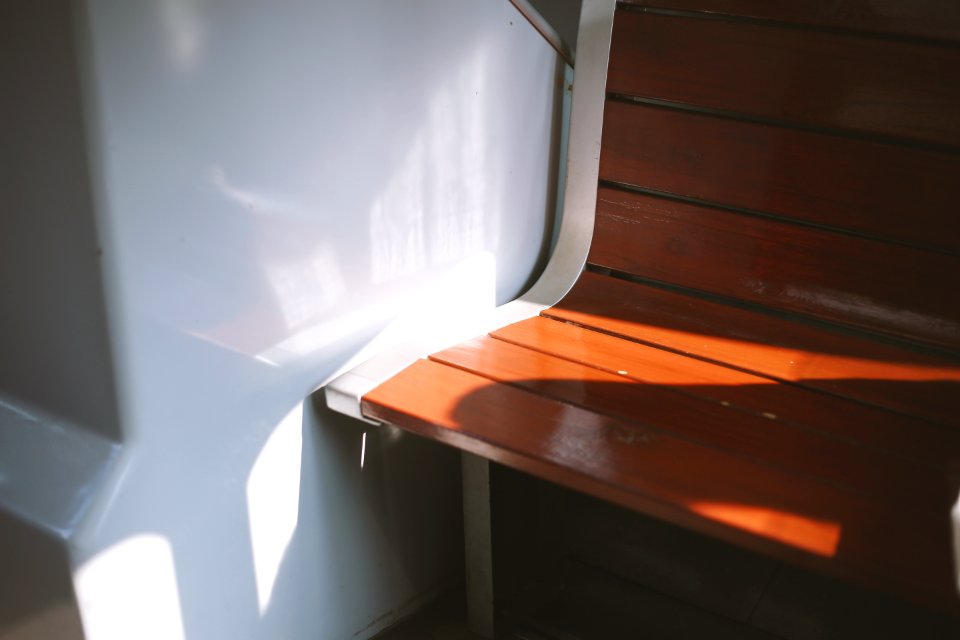 empty wooden chair near wall photo