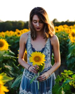 woman standing at sunflower field photo