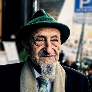 man wearing green hat during daytime photo