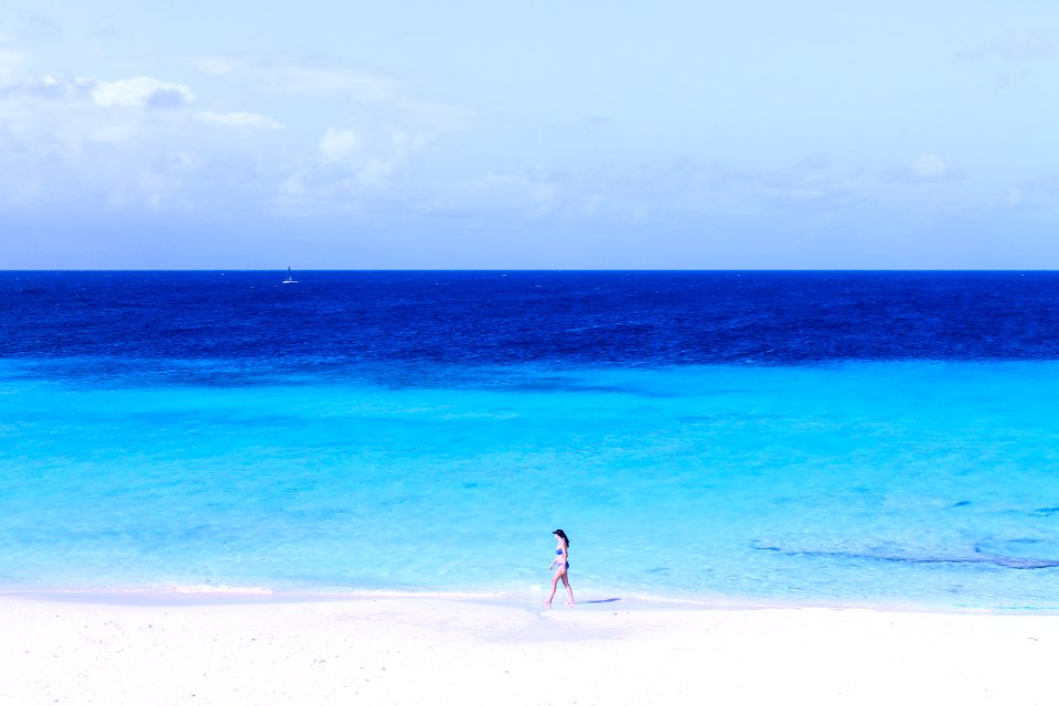 woman walking on seashore