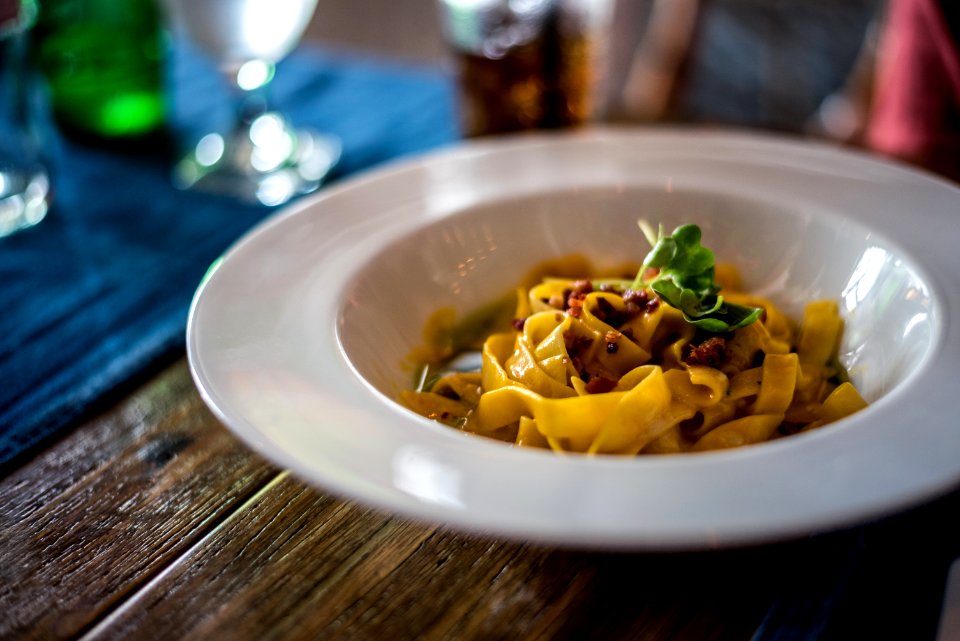 pasta with sauce in white ceramic bowl