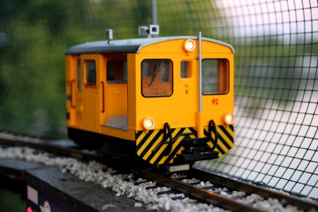 closeup photo of yellow and black train toy photo