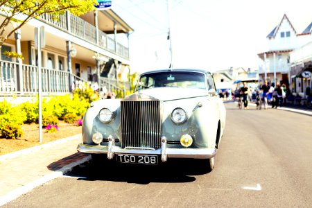 classic white vehicle on concrete road photo