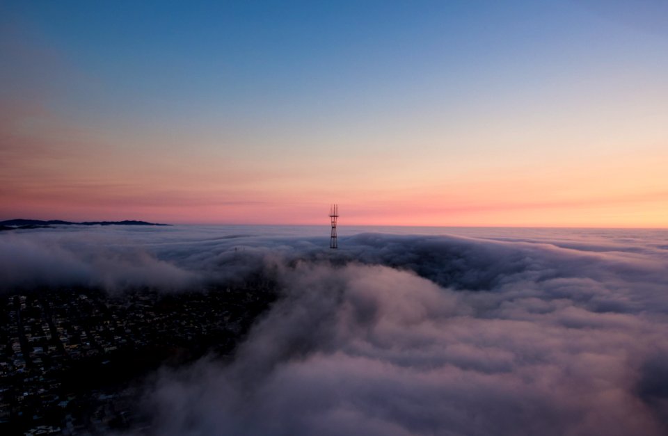 tower surrounded by clouds