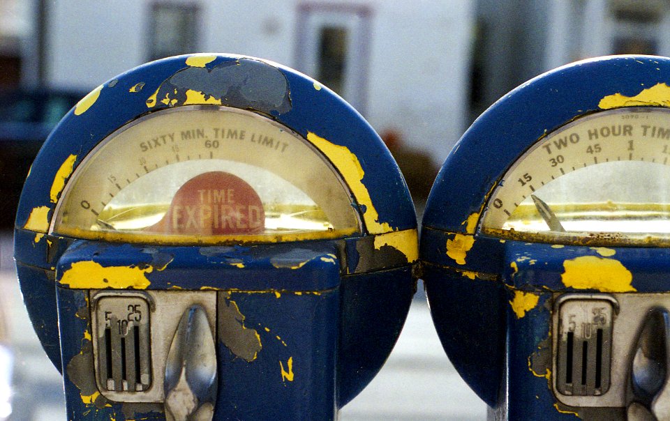 two round blue-gray-and-yellow analog devices