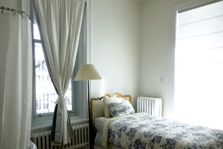 white and blue floral comforter