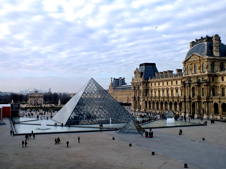 glass structure beside brown building