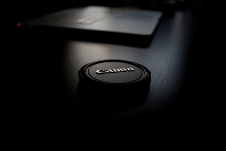 shallow focus photography of black Canon zoom lens cover photo